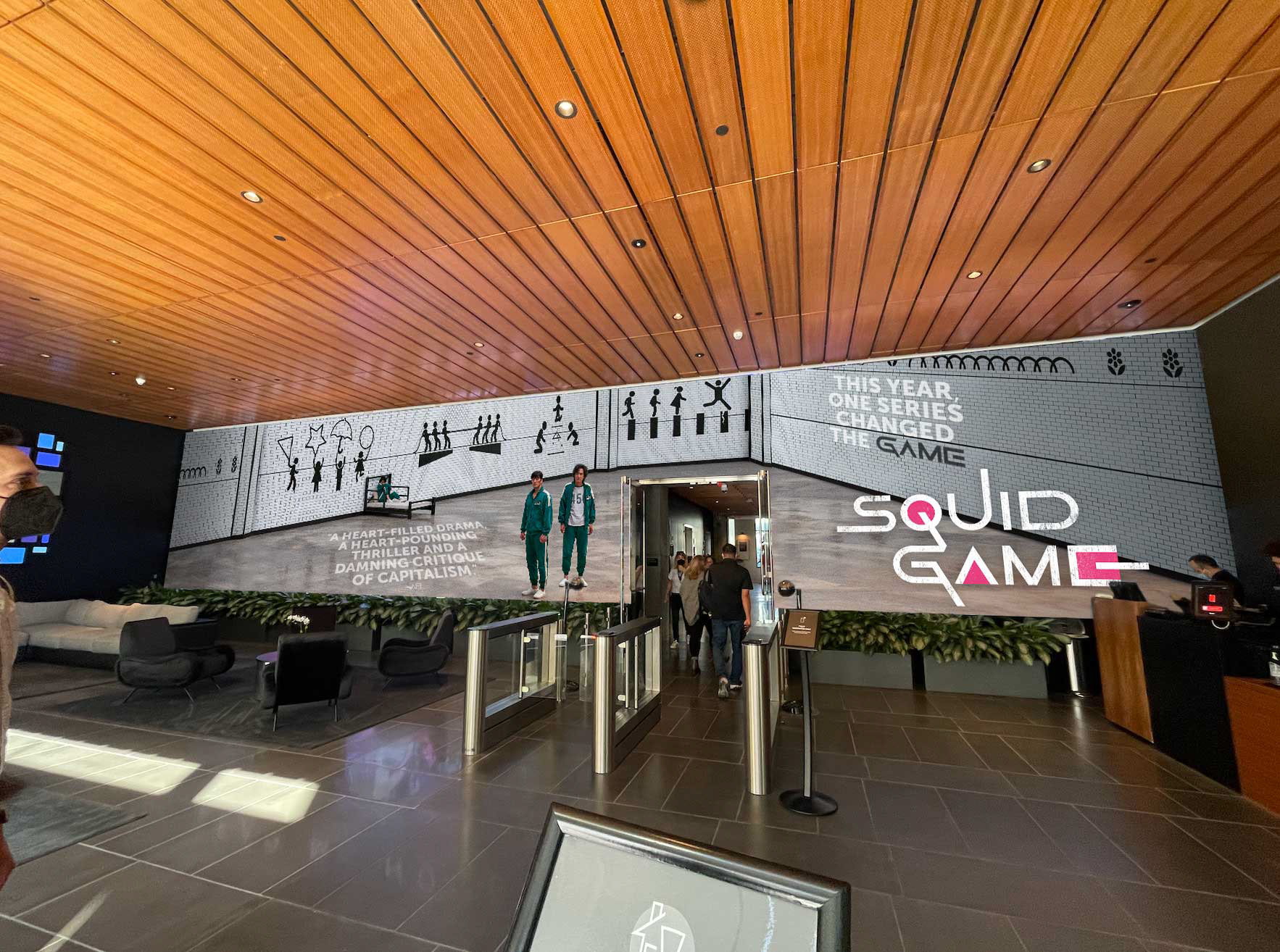 Netflix ICON building lobby wall digital adapts - Squid Game