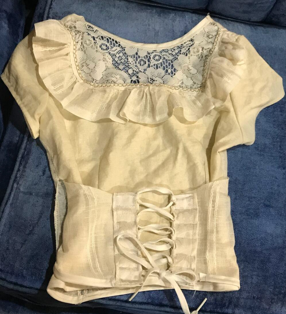 Hand and machine sewed lace-up wrap top using recycled materials. Modified a sewing pattern for a simple wrap shirt.