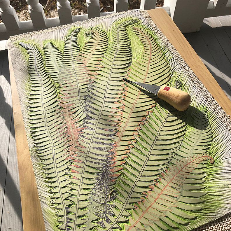 Carving the fern on the front porch.