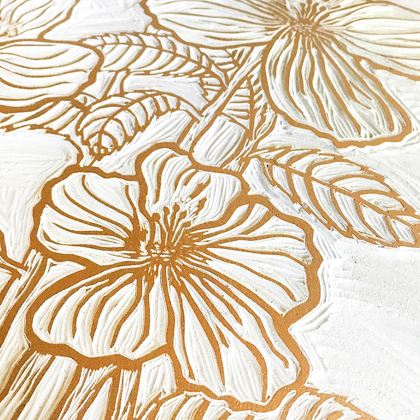 Detail of the hibiscus carving inked with gold ink for the first time.