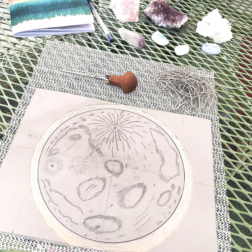 Carving the moon.