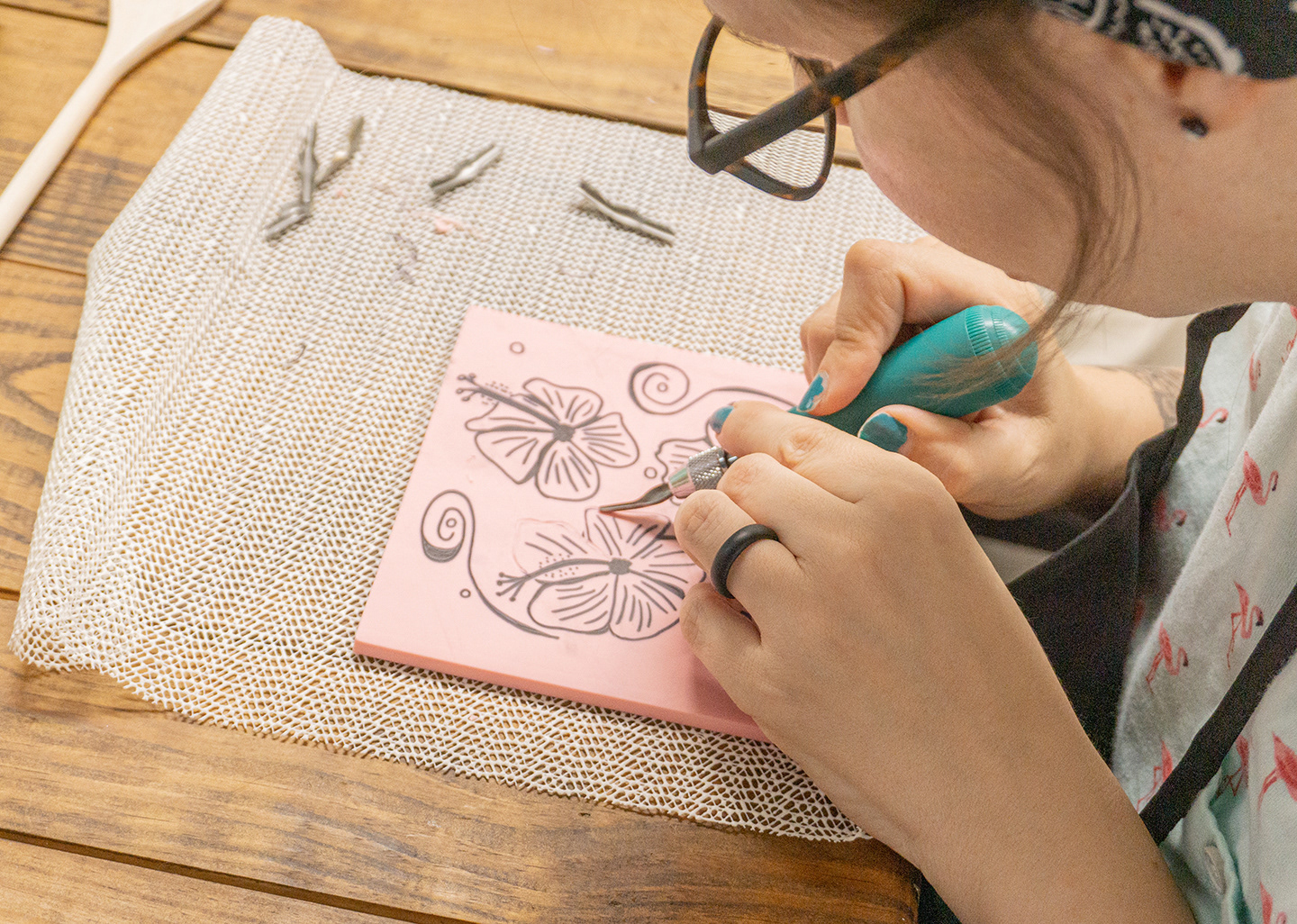 Student carving flower.