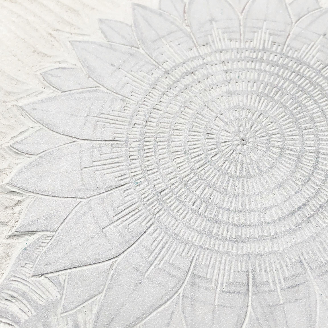 Detail of sunflower carving.