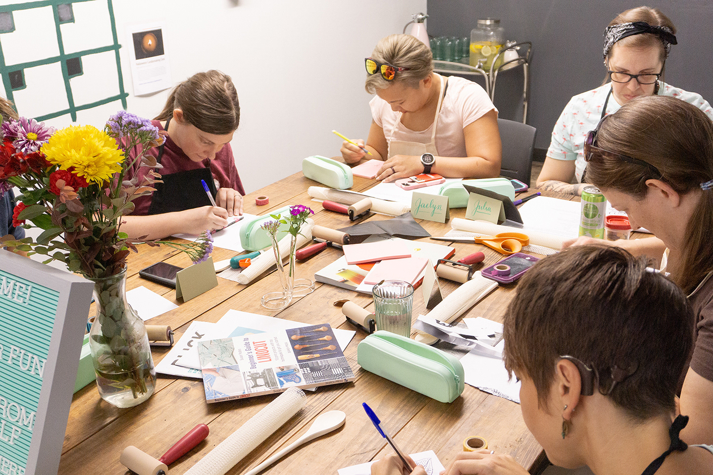 Students drawing on their carving blocks.