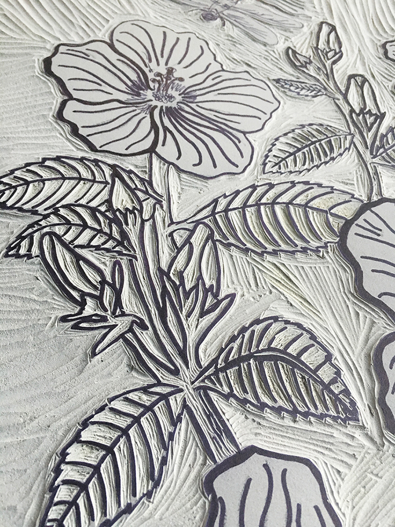 Linoleum carving in progress for a hibiscus flower.