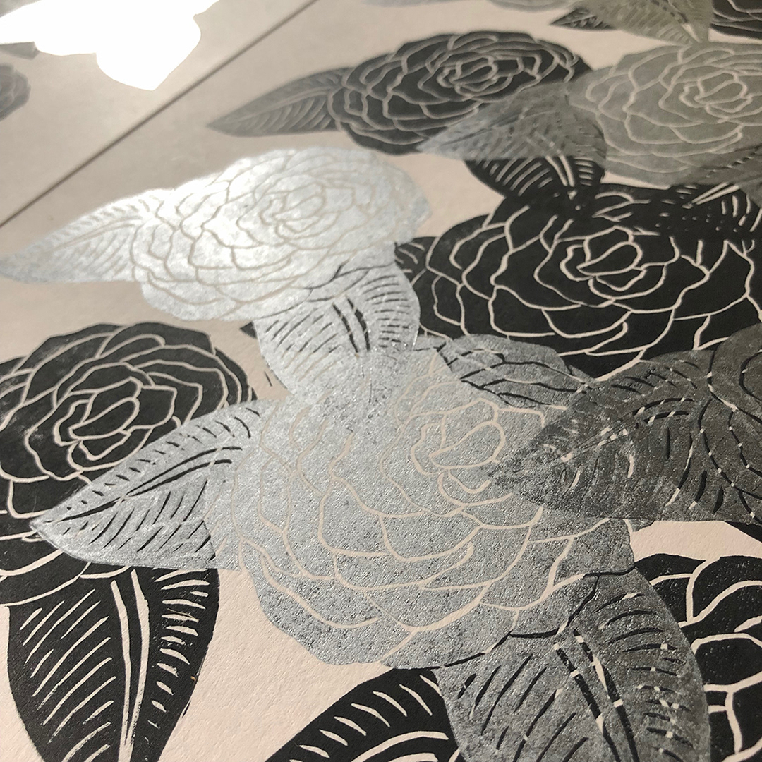 Silver ink shining in the light.