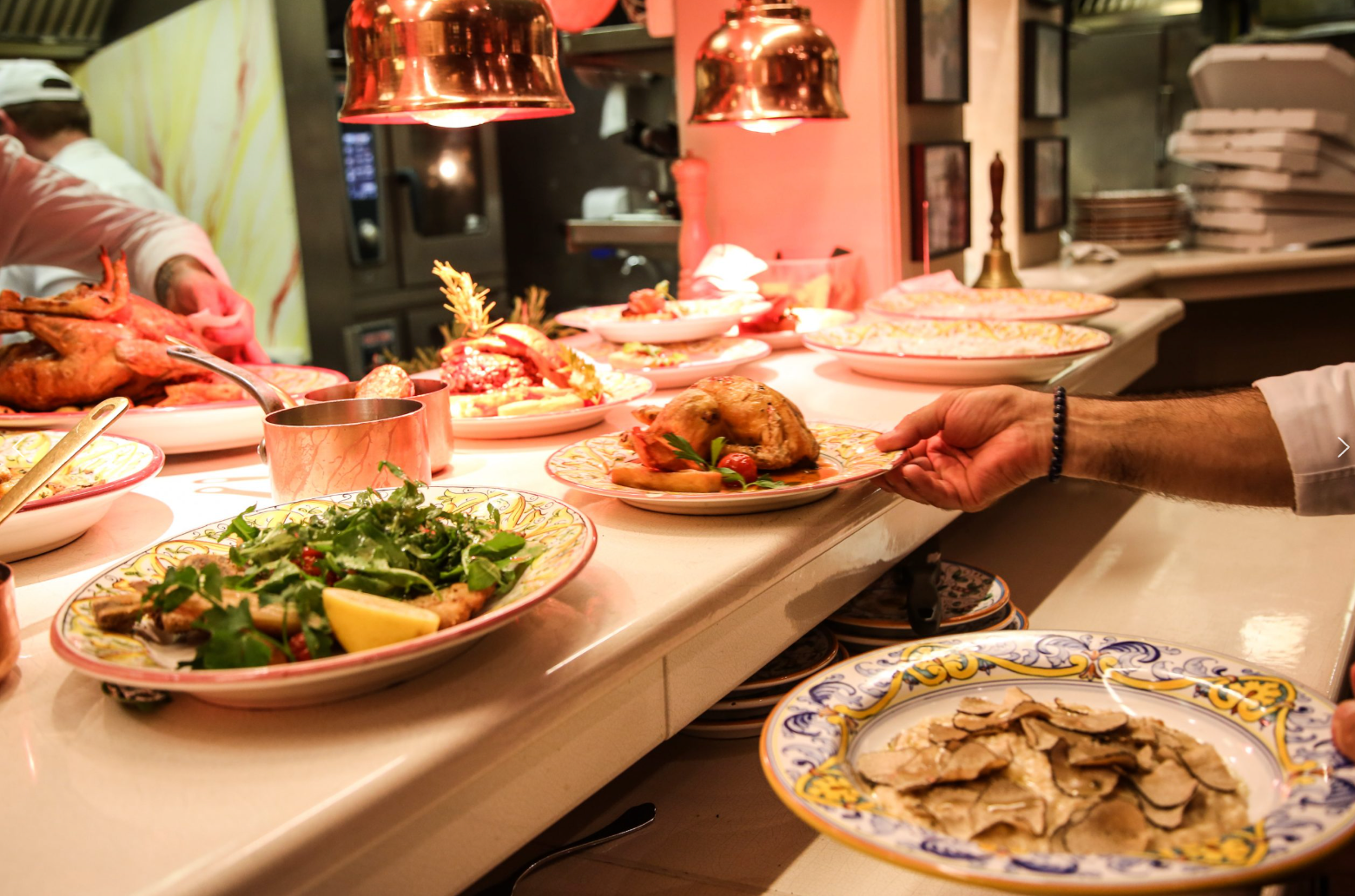 Watch the magic happen in our open kitchen, where traditional recipes come to life.