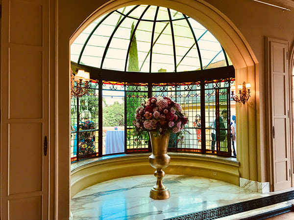 Bespoke floral scenography creating a grand entrance for your guests.