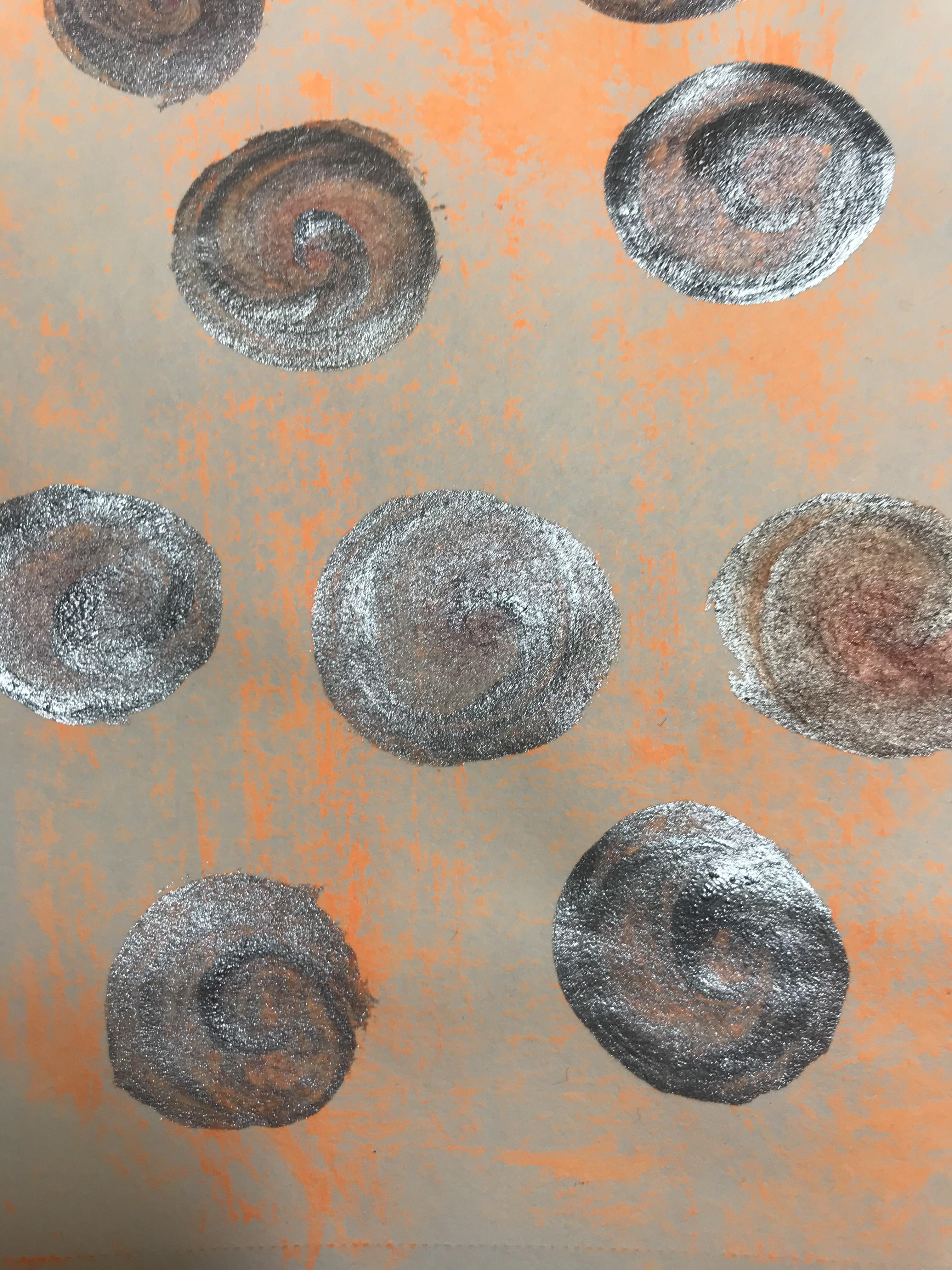I like the subtlety of the orange in the background and the bright silver glitter circles. I think it makes a cut print.