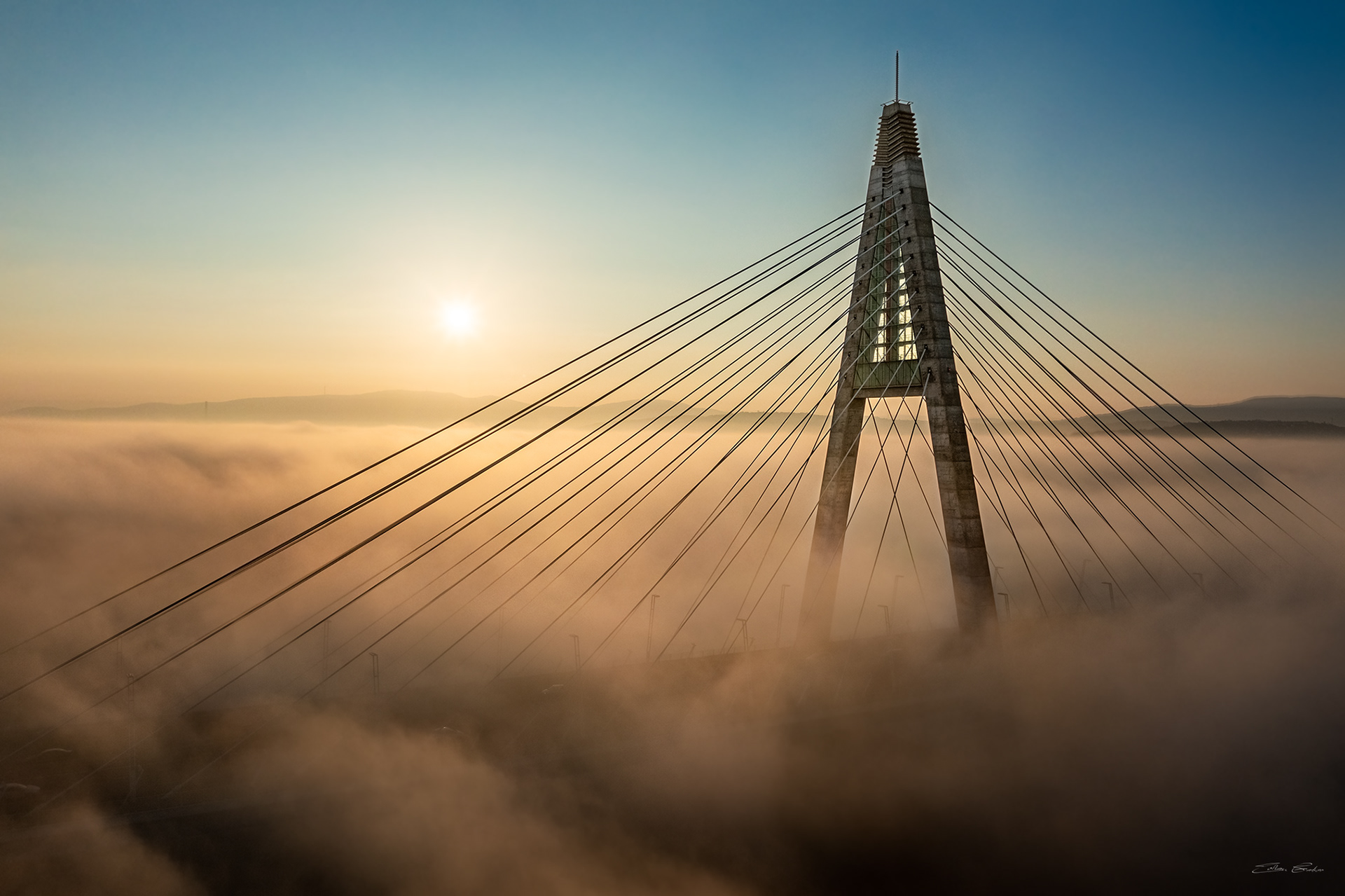Megyeri Bridge in heavy autumn fog from above