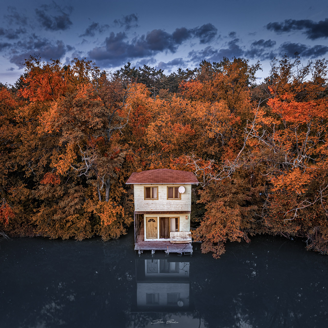 Aerial view of a romantic fisherman's cabin by Lake Derito