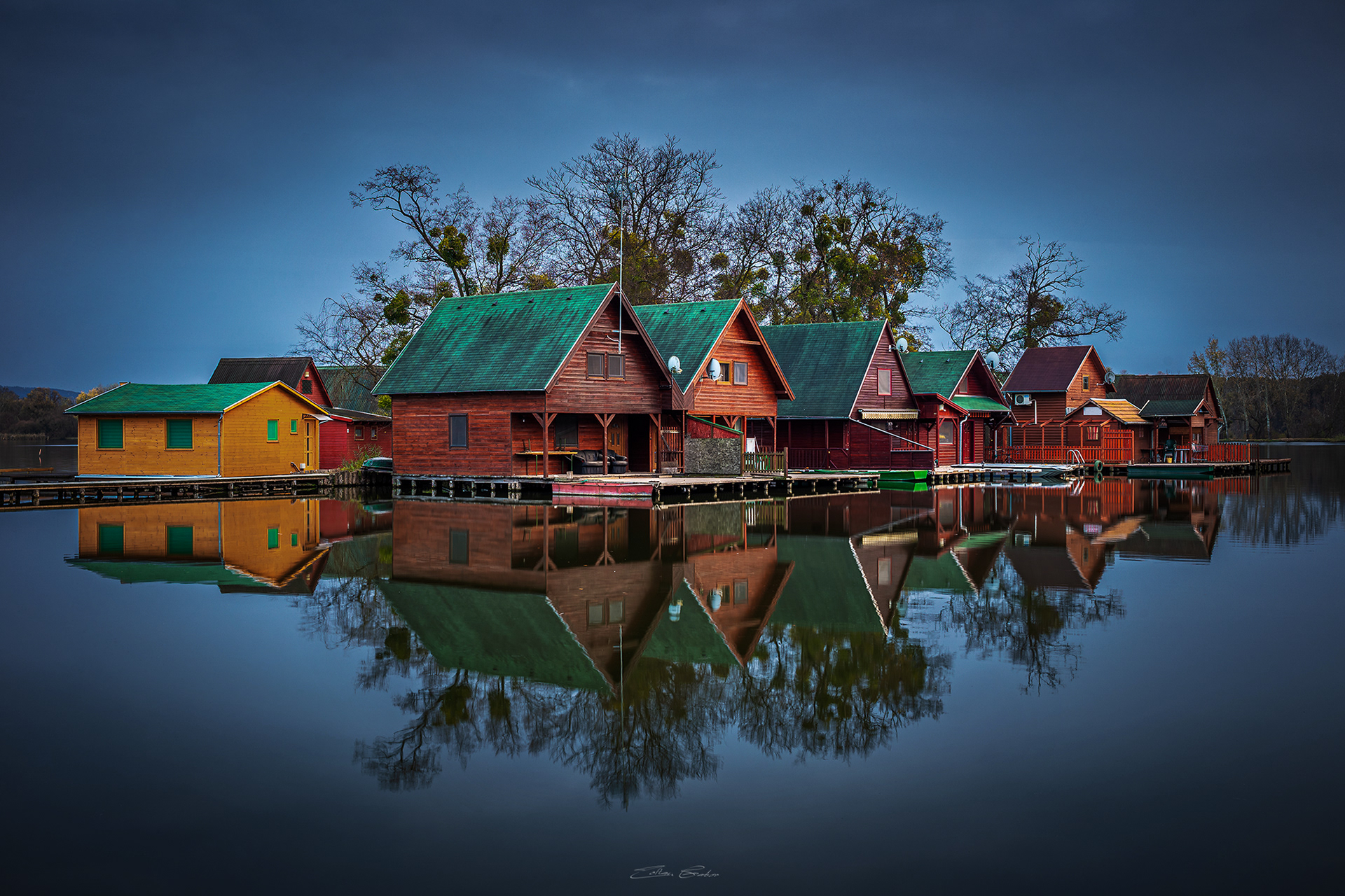 Small Island with colourful Fishing Huts at dusk