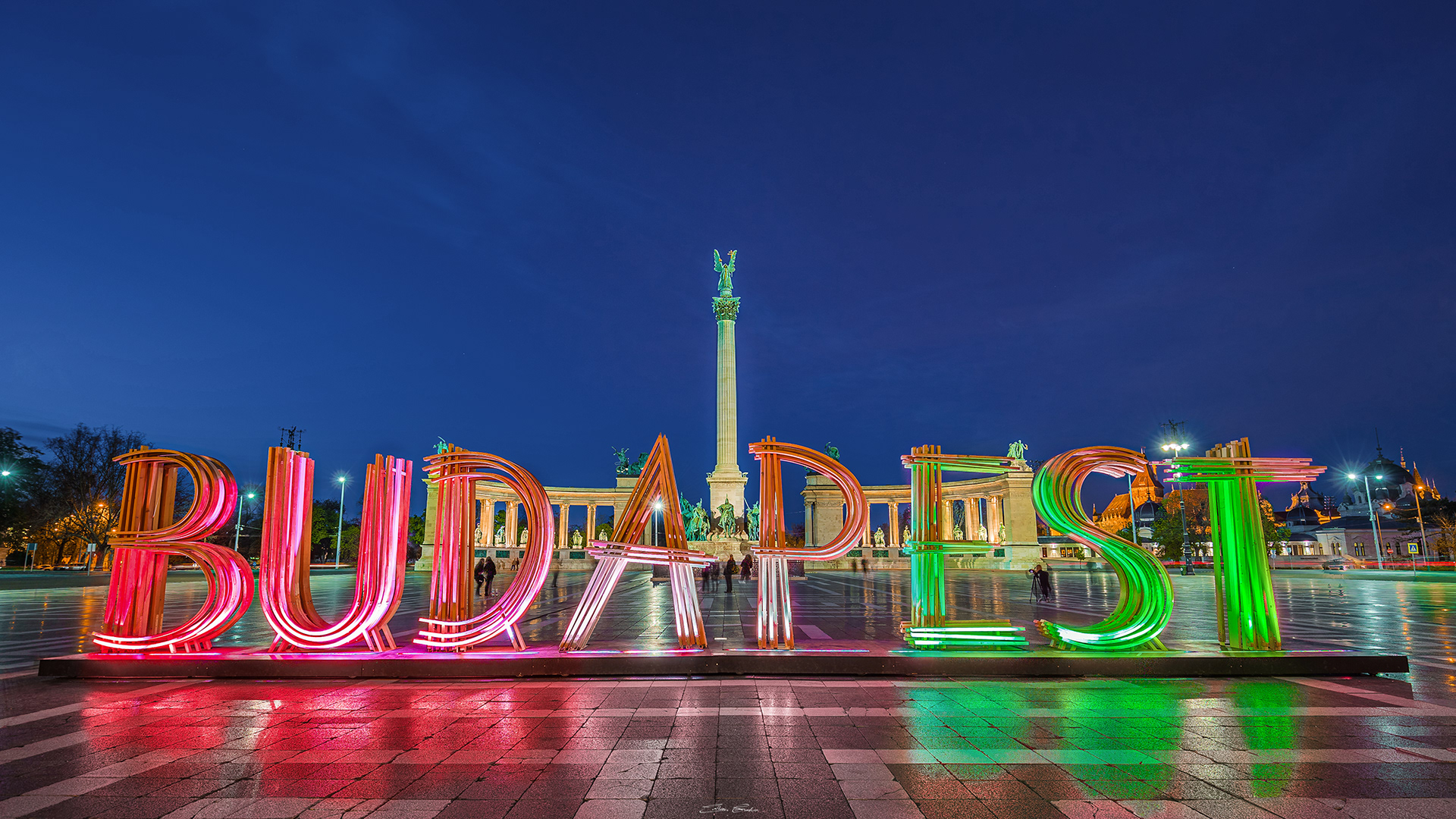 Illuminated Heroes' Square and Budapest sign