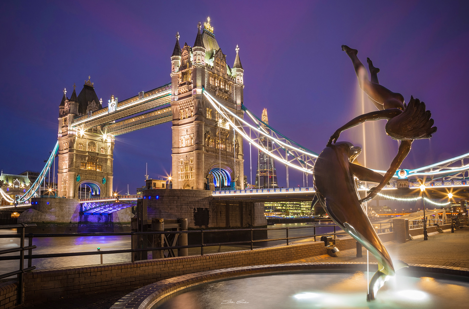 Lady and the Dolphin fountain with Tower Bridge