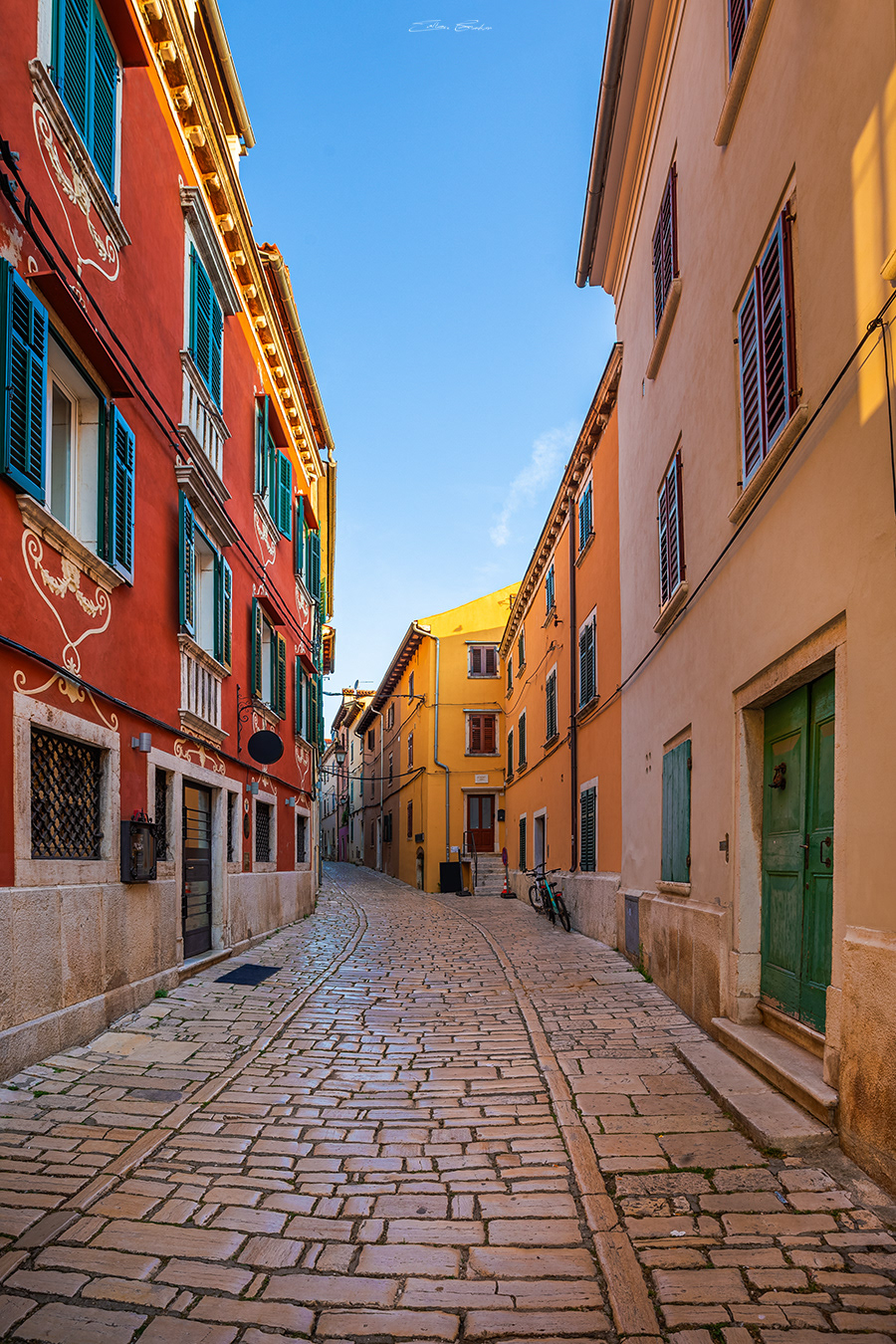 Cobblestone alley in Rovinj, Croatia at sunrise