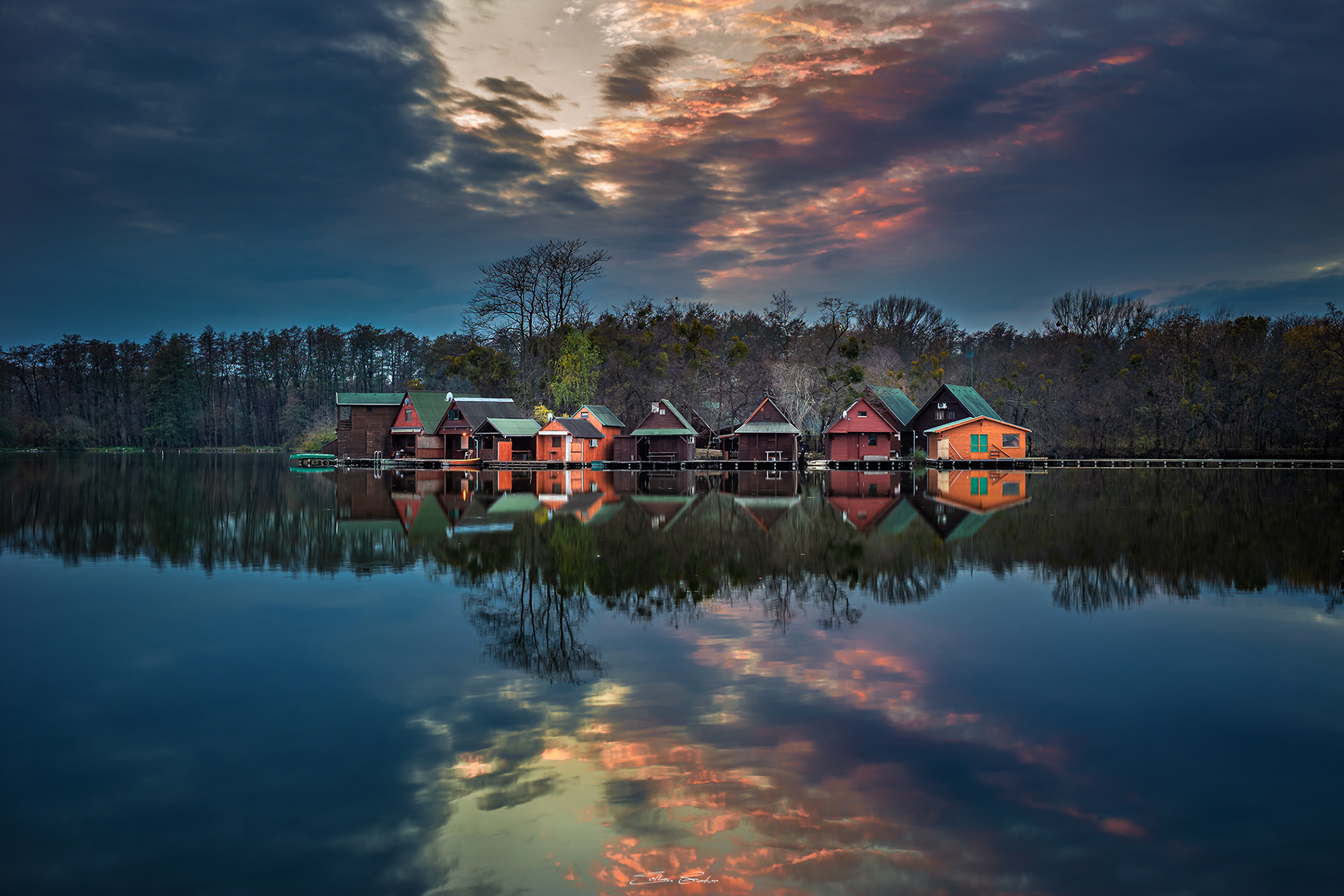 Small Island with colourful Fishing Huts at sunset