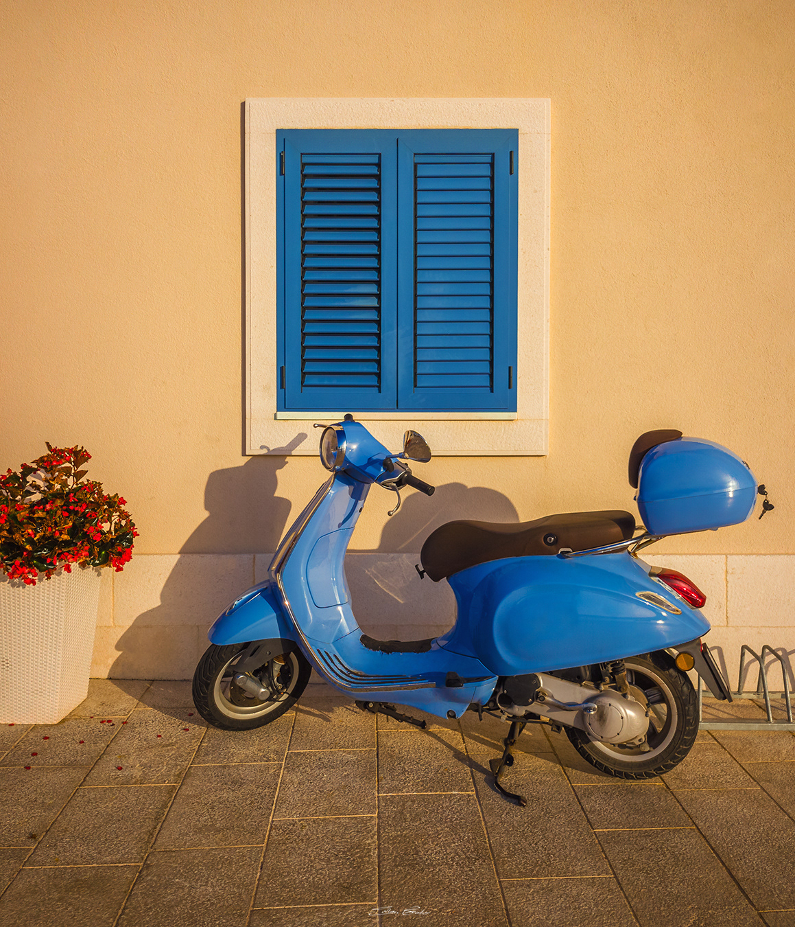 Old scooter and blue window in Primosten