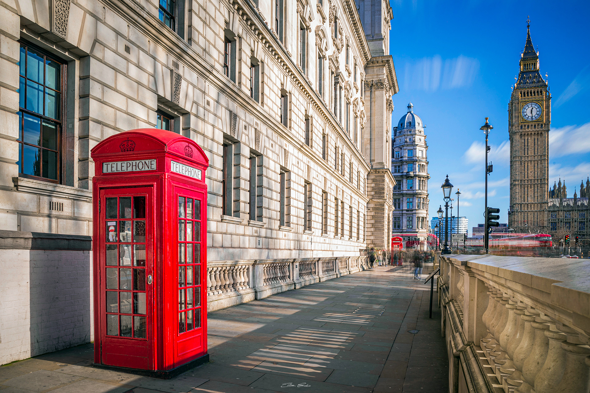 Iconic Red Telephone Box with the Big Ben and Double-Decker buses