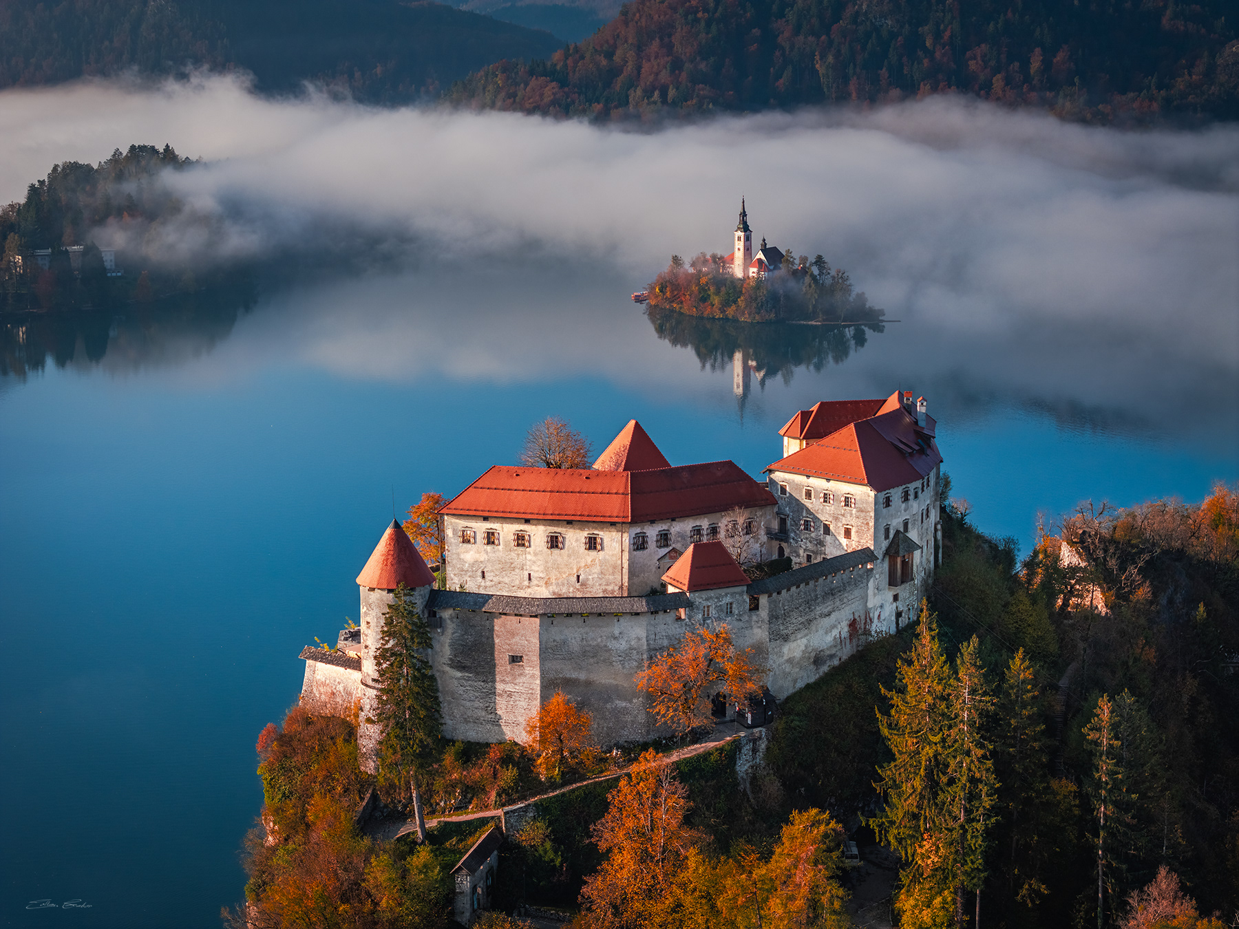 Bled Castle and Bled Island on a foggy autumn morning