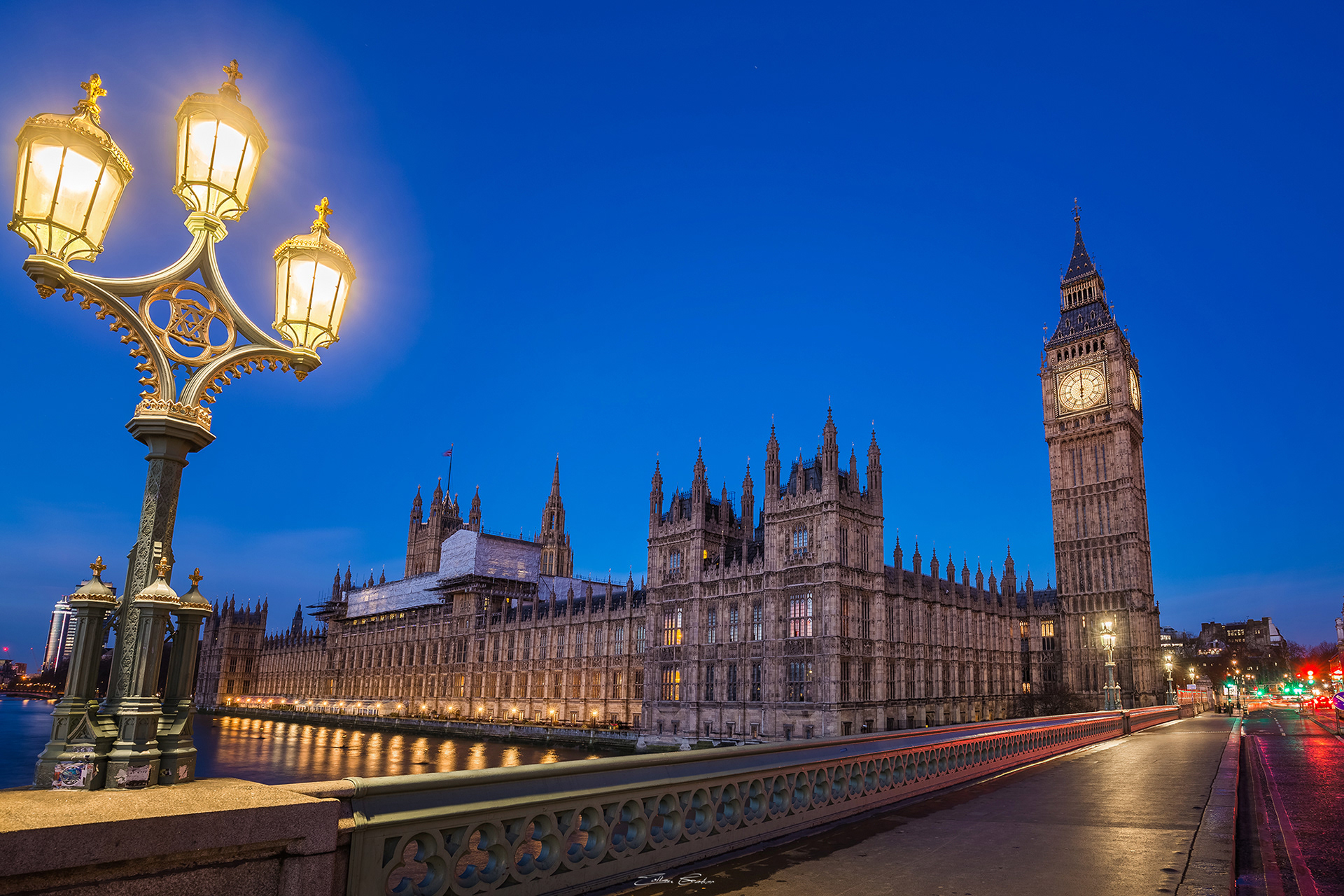 Street lamp on Westminster Bridge by night with Big Ben and Parliament building