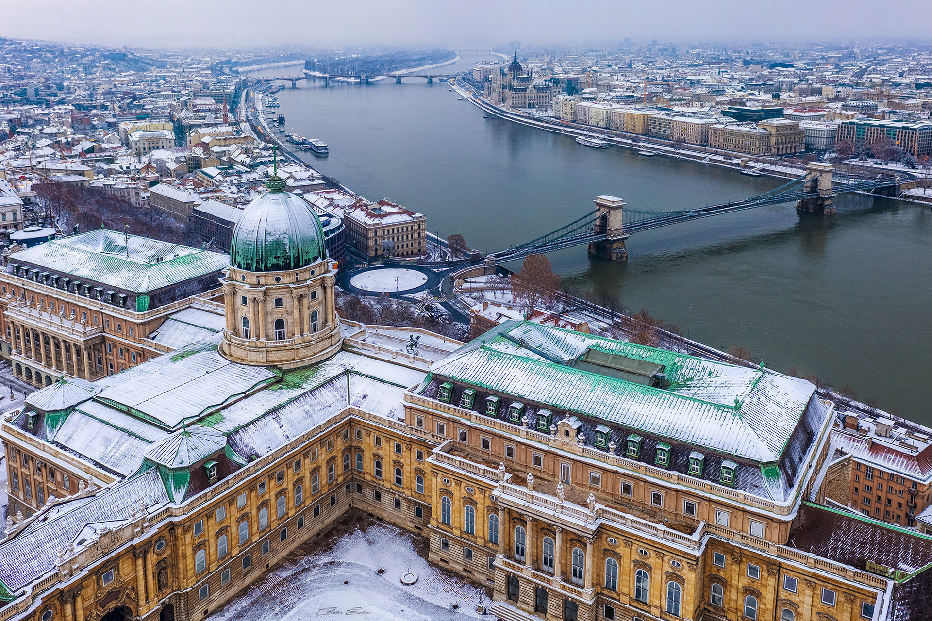 Snowy Buda Castle and Széchenyi Chain Bridge at winter time