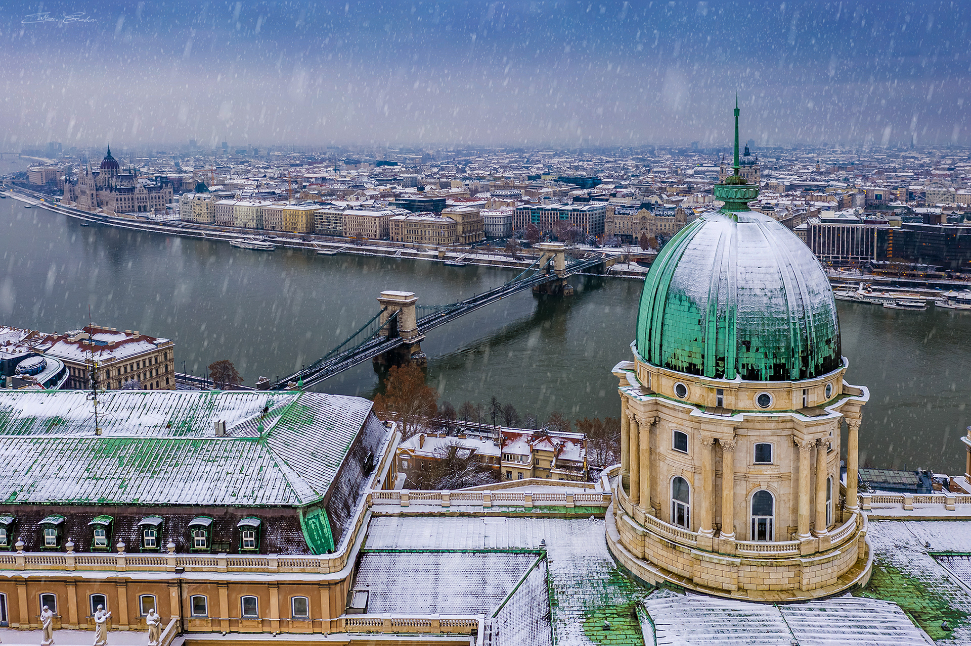 Snowy winter scene at Buda Castle with Chain Bridge