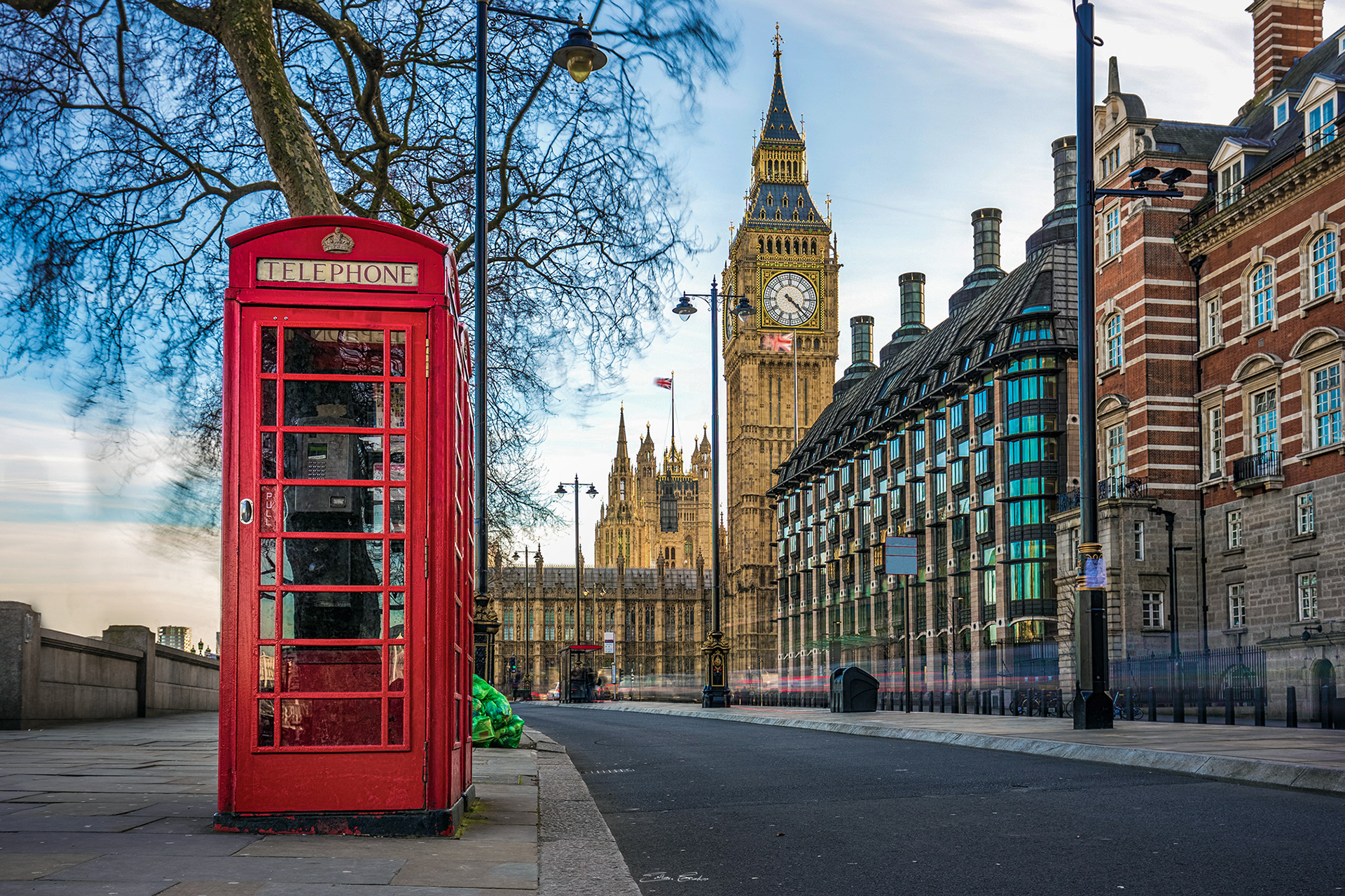 Iconic Red Phone Booth with the Big Ben at background - Westminster