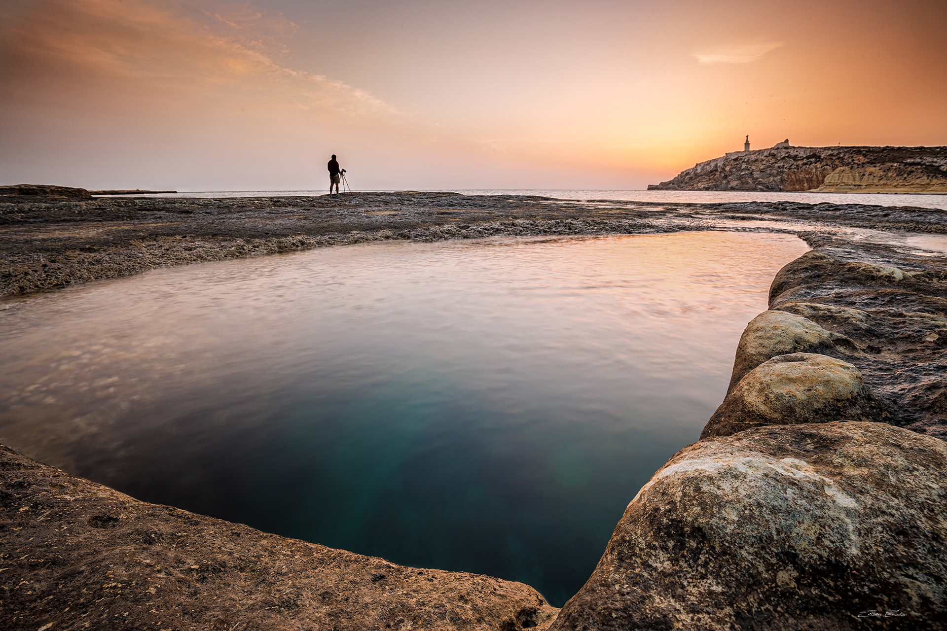 Photographer at St. Paul's Island at sunrise
