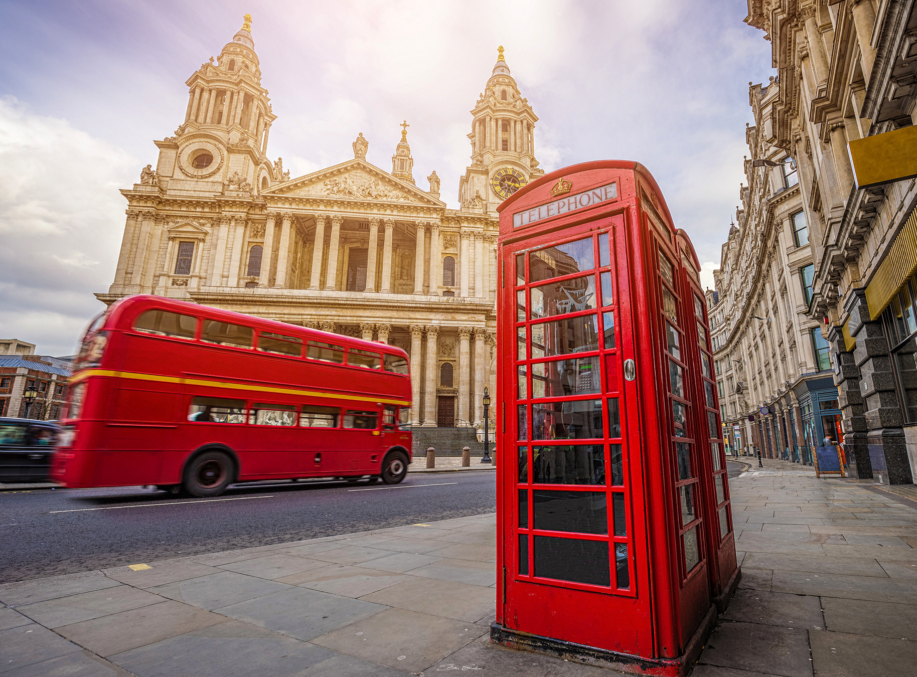 Iconic Red Telephone Booth with Vintage Red Double-Decker Bus and St.Paul's Cathedral - London