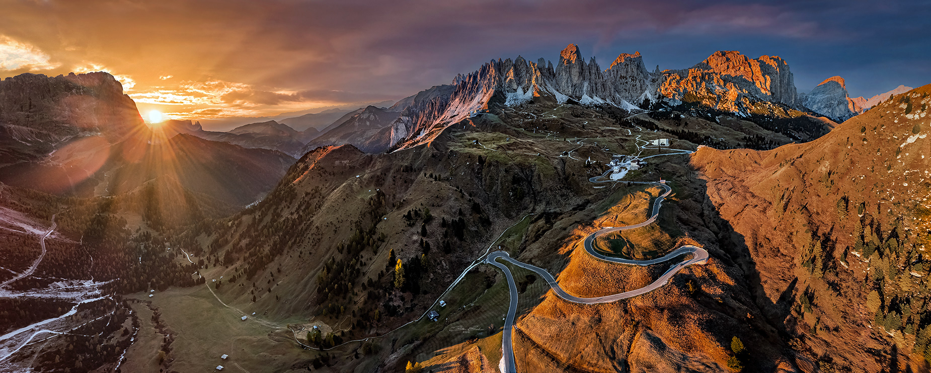 Aerial panoramic view of Gardena Pass at sunset