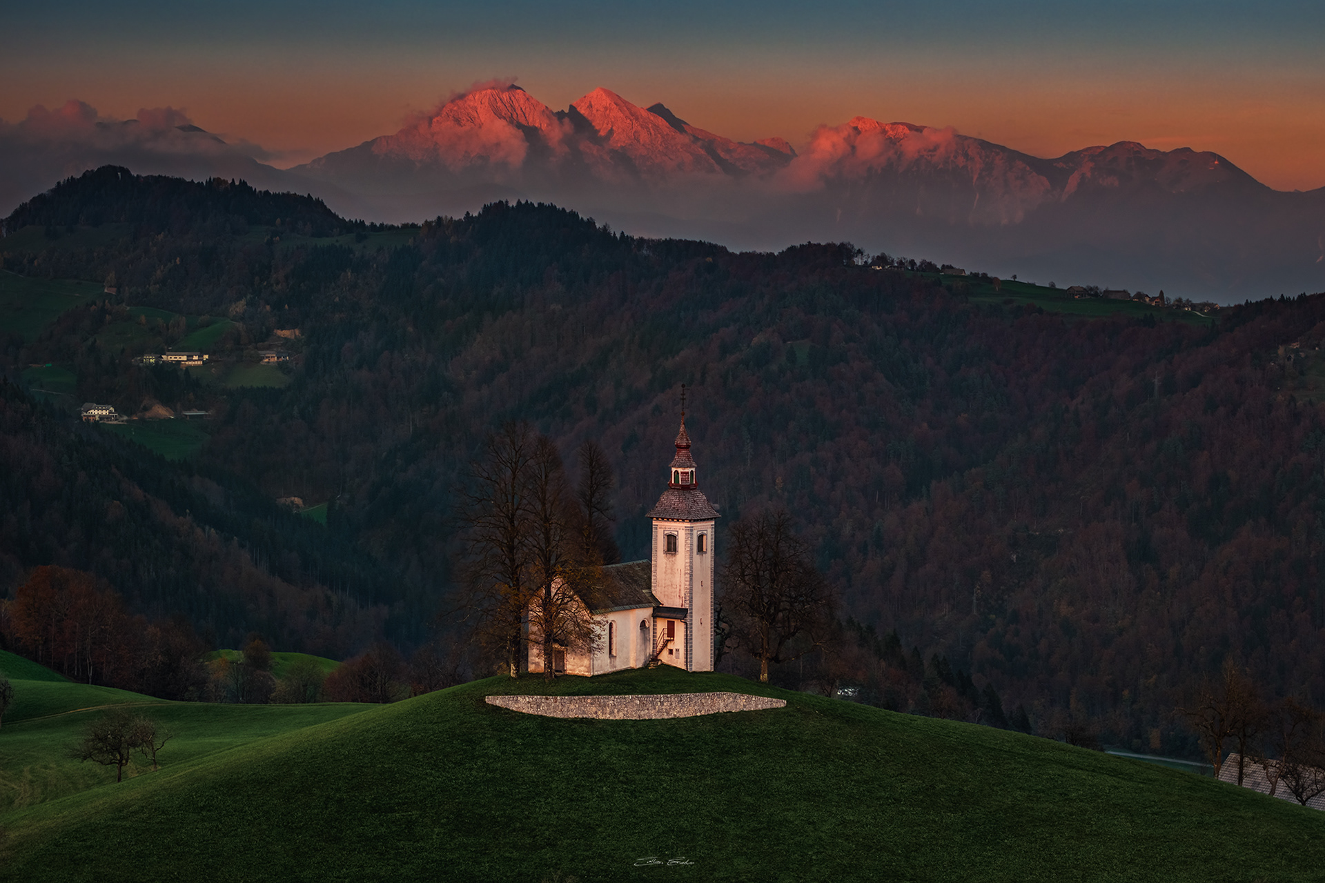 Sveti Tomaz church with the Alps at background