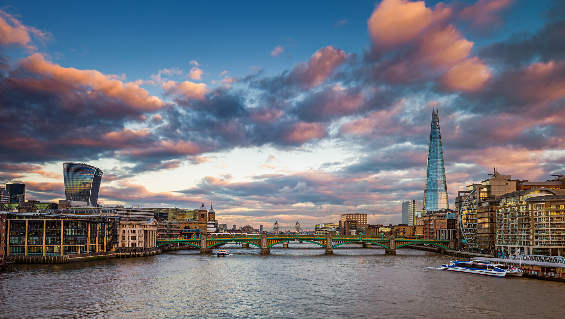 Colorful clouds over downtown of London with the Shard and Sky Garden skyscrapers