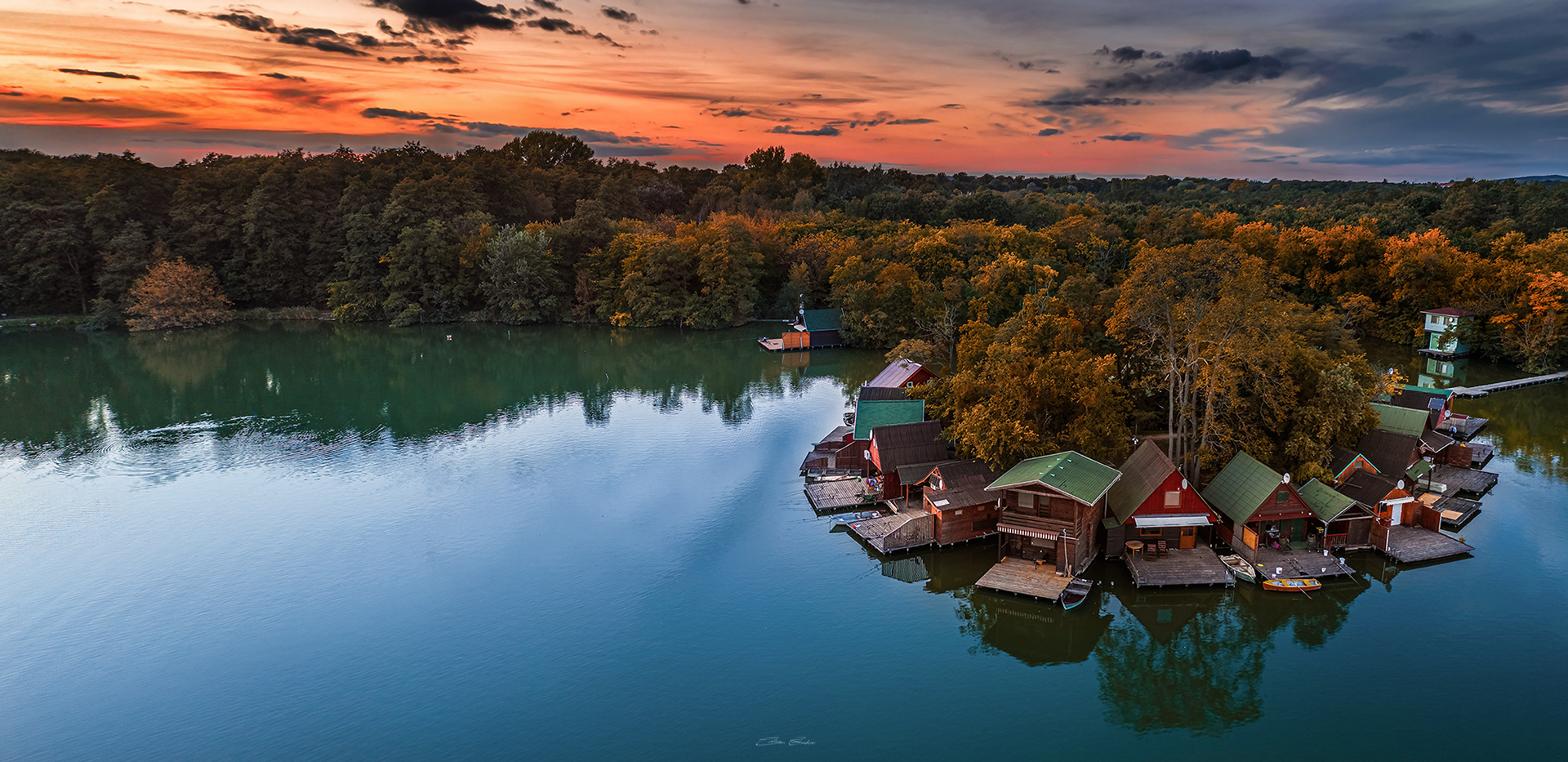 Small Island with colourful Fishing Huts at sunset