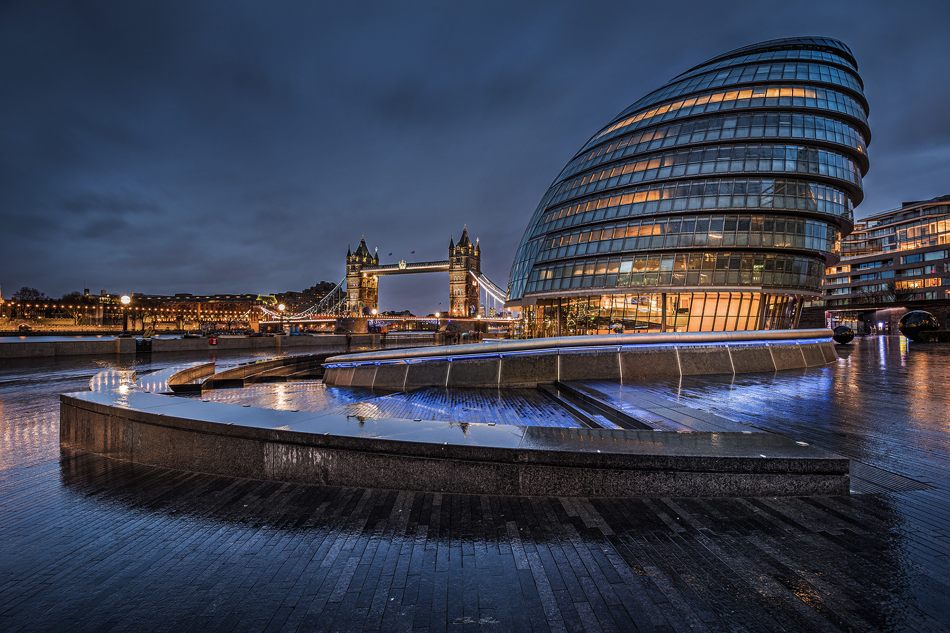 City Hall building and Tower Bridge by night