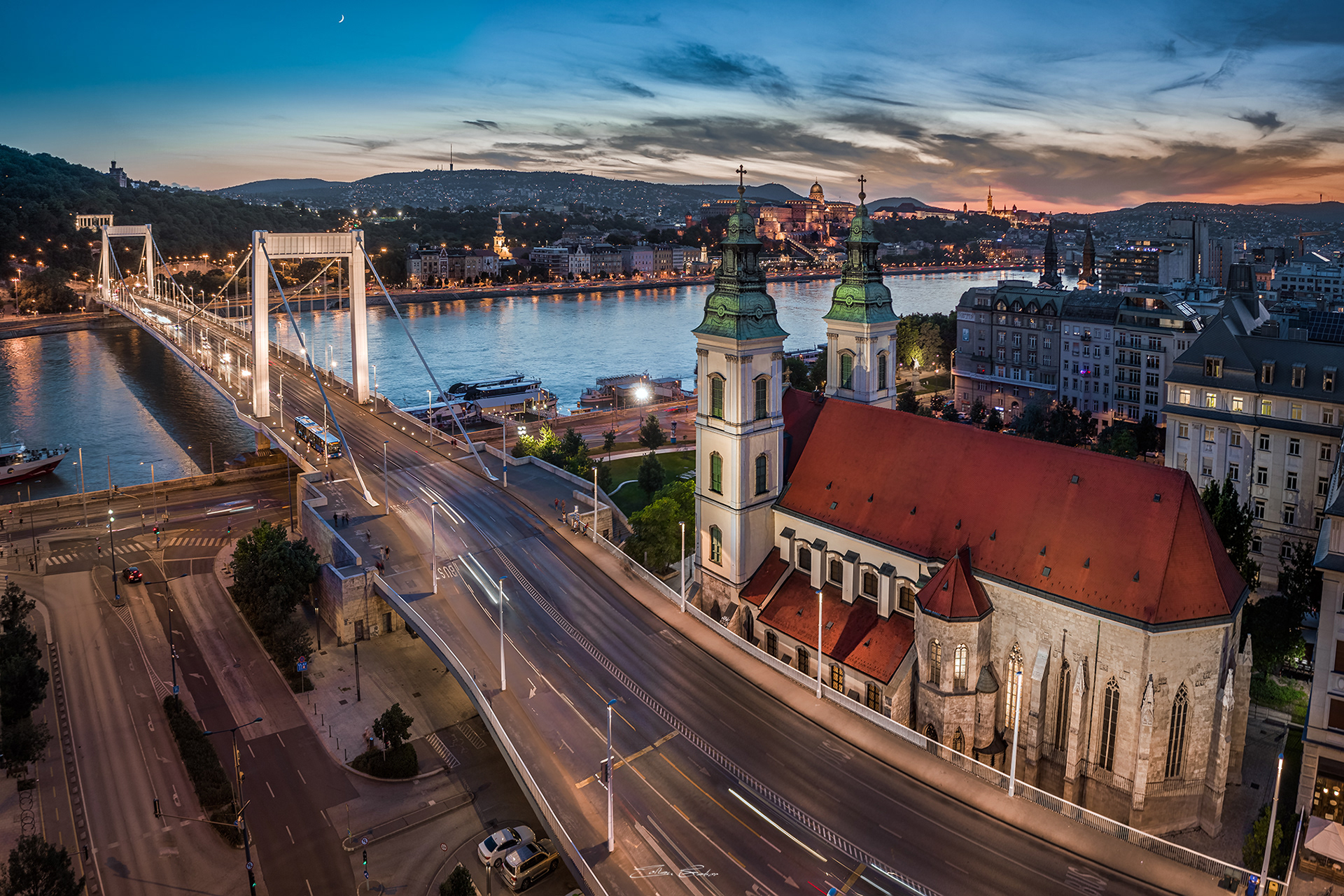 Aerial view of Budapest Inner-City Mother Church of Our Lady of the Assumption and Elisabeth Bridge at dusk