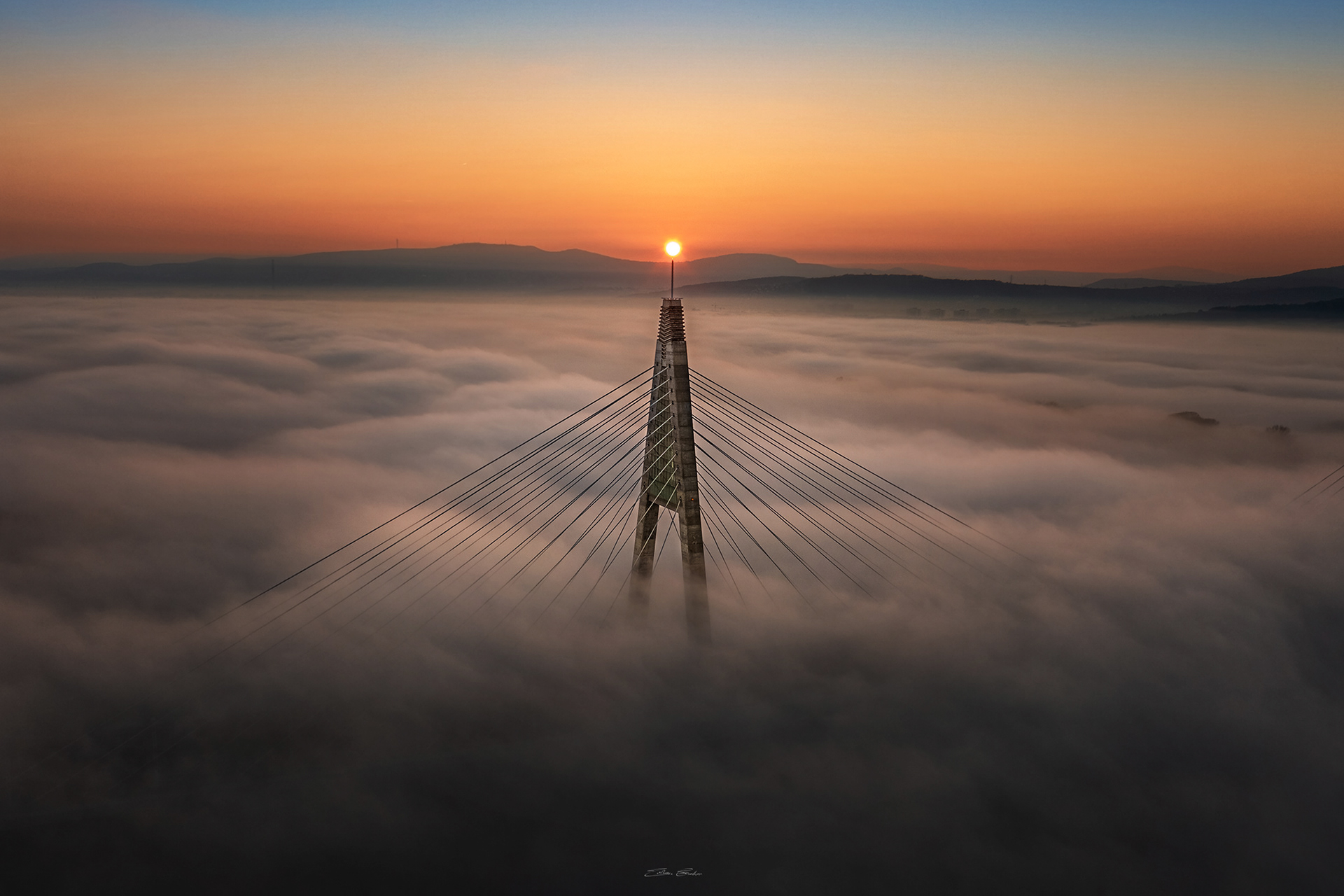 Megyeri Bridge in heavy autumn fog from above