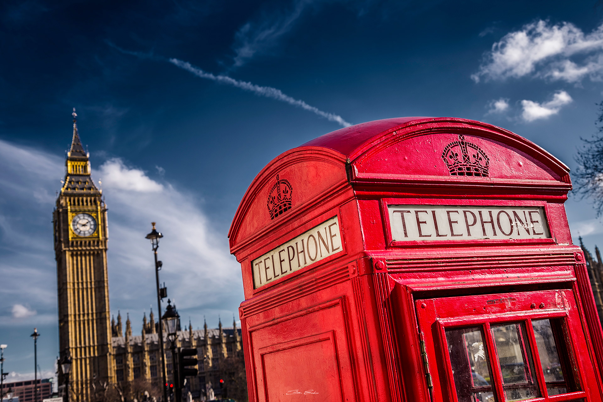 Iconic Red Telephone Booth with Big Ben at background