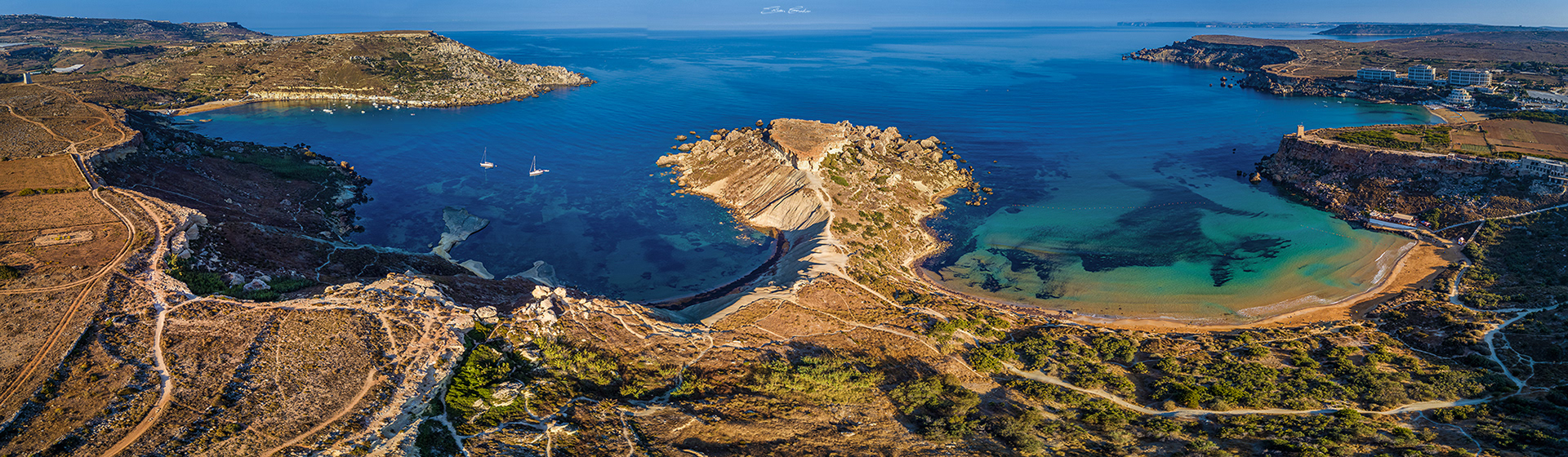 Aerial panoramic view of Gnejna bay, Qarraba Bay and Golden Bay