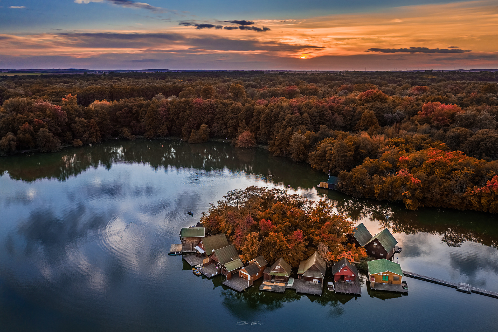Aerial view of a Small Island with Fishing Huts on the lake at autumn