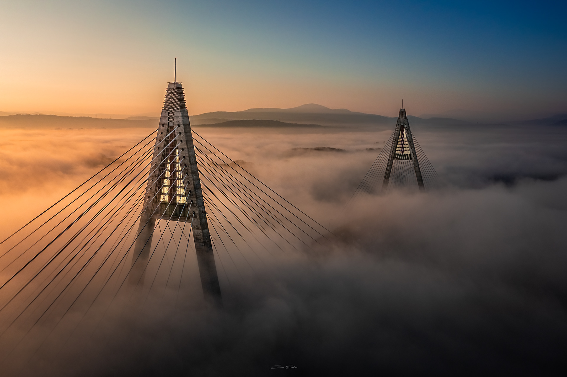 Megyeri Bridge in heavy autumn fog from above