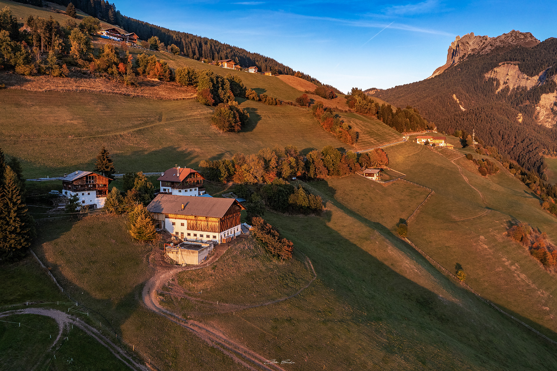 Tyrolean houses at Santa Maddalena village with an autumn sunset