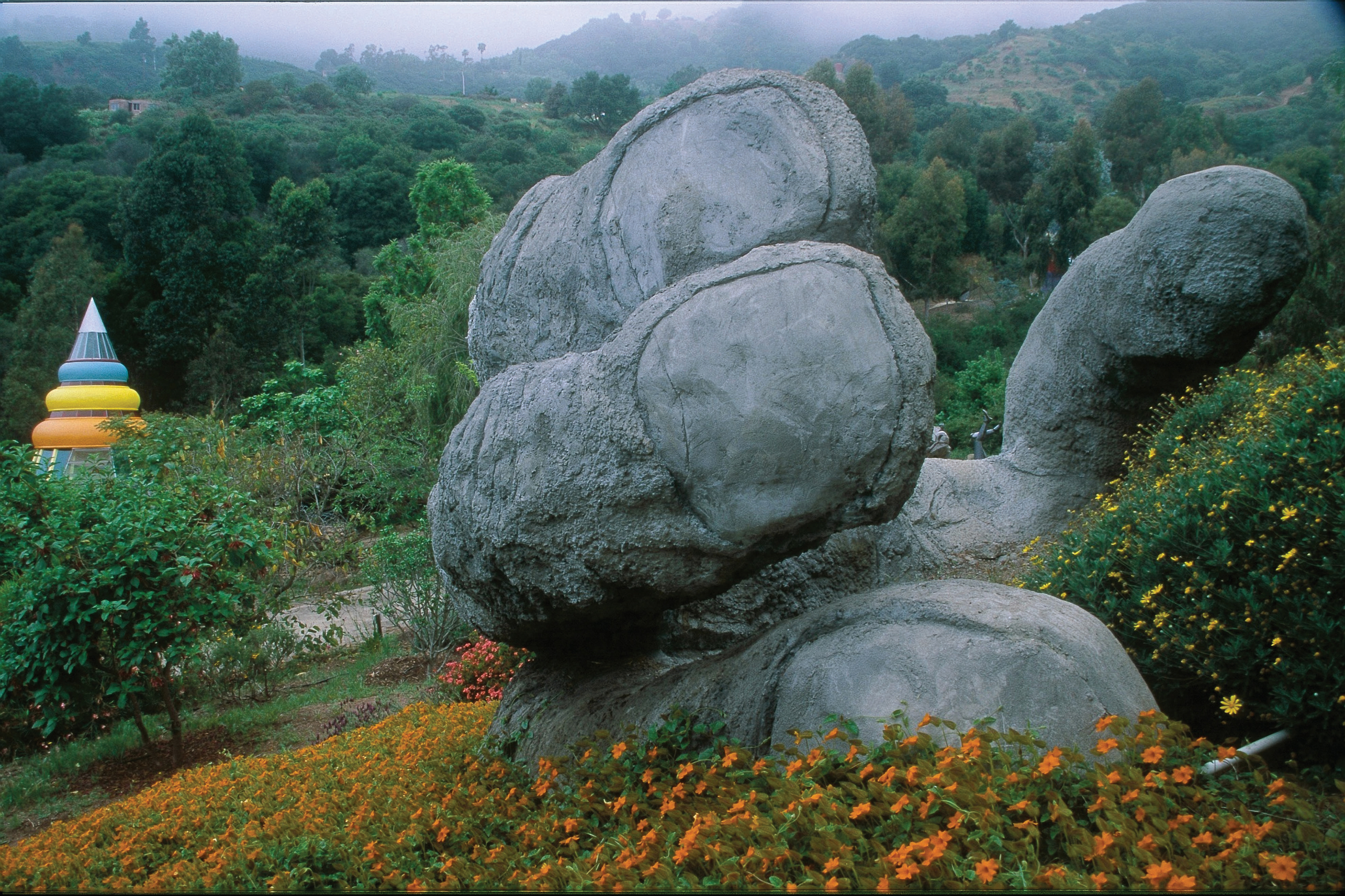 Giant's hand with studio in background