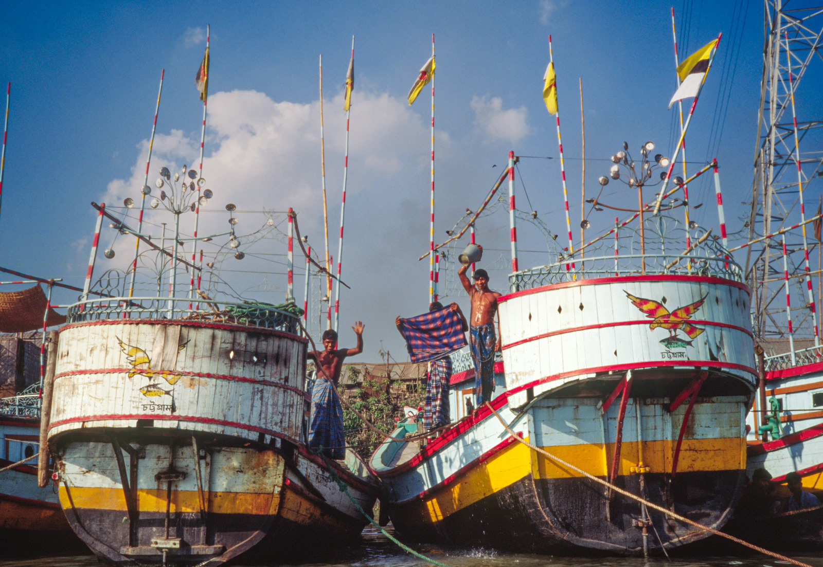 Crew washing on riverboat ferry. Dhaka, Bangladesh