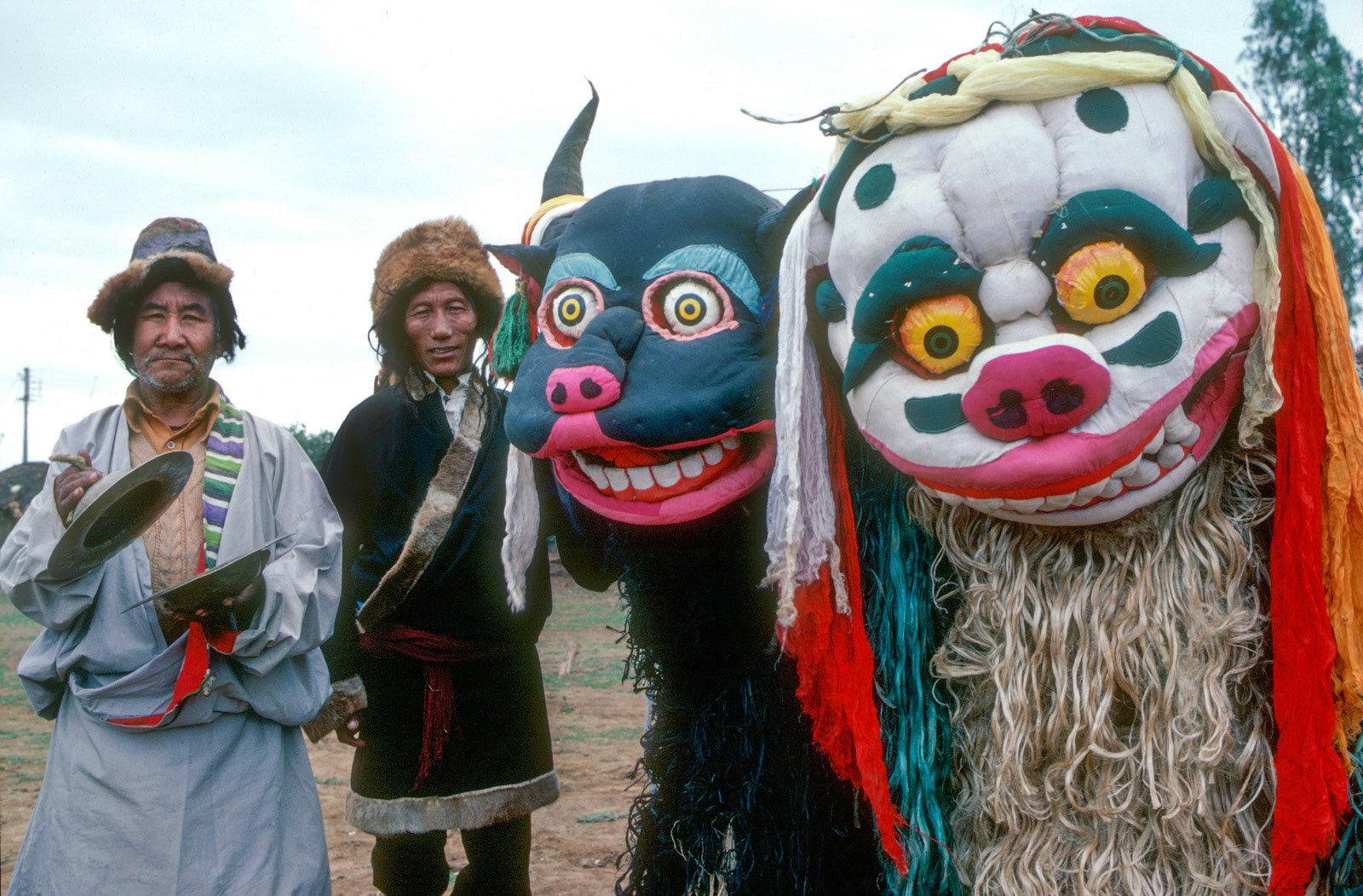 Tibetan snow lion and yak dancers. Orissa, India