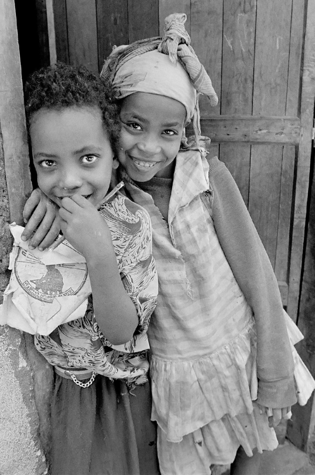 Two friends in a doorway. Addis Ababa, Ethiopia