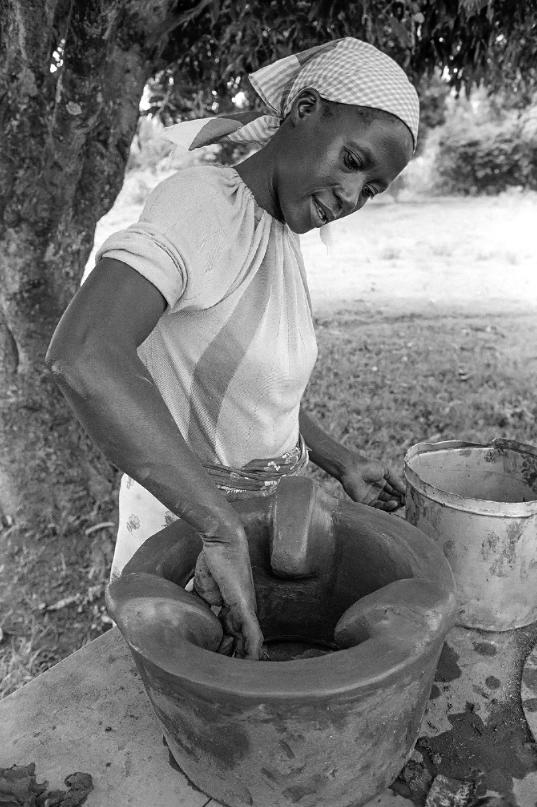 Potter making a  fuel-efficient  stove at a women's co-op. Kisumu, Kenya