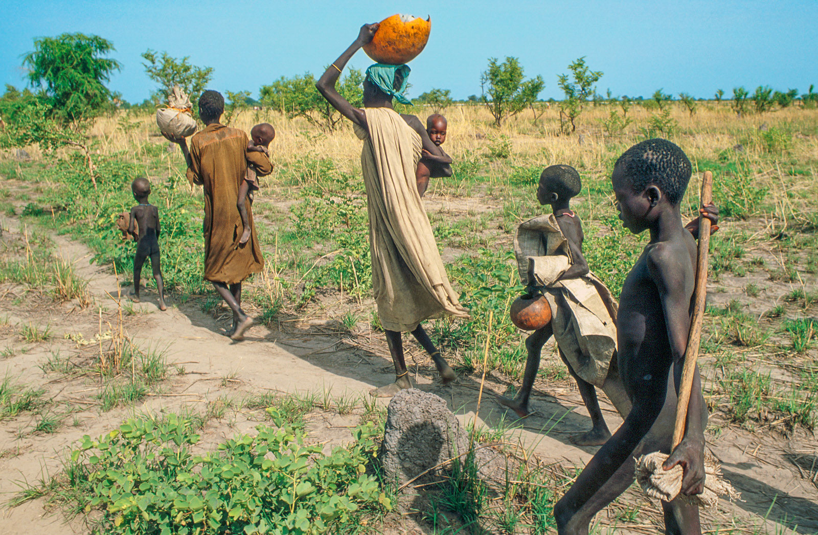 Family fleeing war to a refugee camp. South Sudan