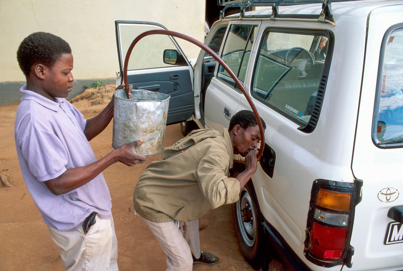 Selling diesel by the roadside. Zambezia, Mozambique