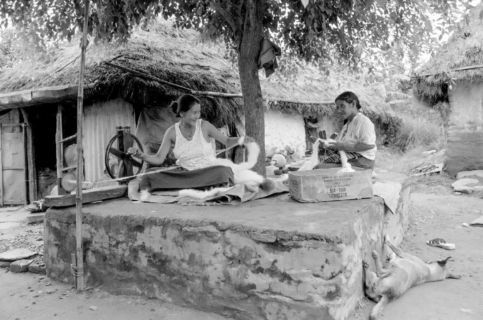 Tibetan refugees winding wool for carpets. Pokhara, Nepal