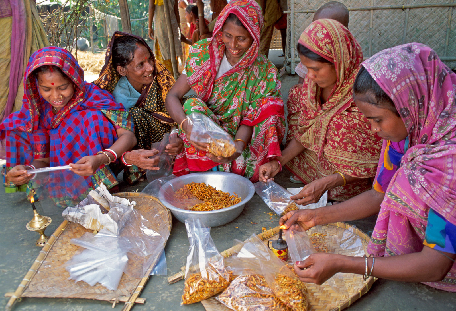 Women's cooperative making snacks. Bangladesh